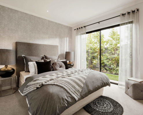 bedroom with tree views