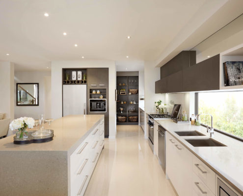 Modern open plan white kitchen area.