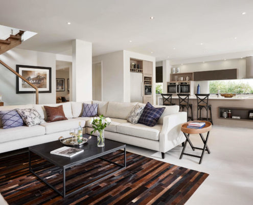 OMNI Sorrento 33 modern home interior. Living area with comfy white corner sofa.
