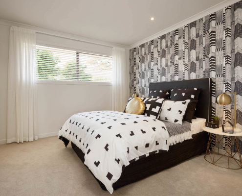 modern bedroom with tiled feature wall